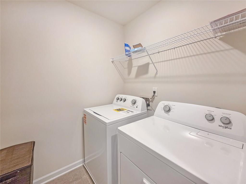 1120 Edinberg Drive Villa Rica, GA 30180 - Photo 23 of 35 a utility room with dryer and washer