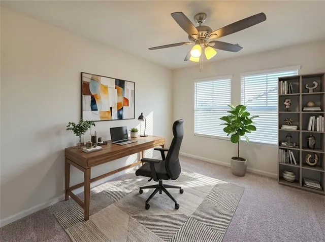 a workspace with furniture and a potted plant
