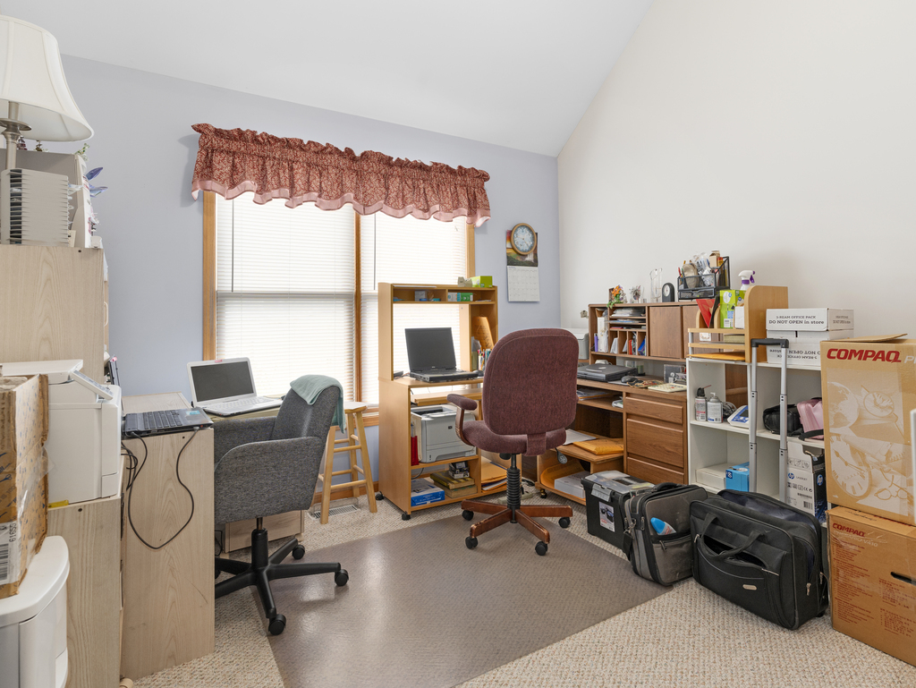 704 Clifford Drive Minooka, IL 60447 - Photo 17 of 25 a view of a workspace with furniture and a window