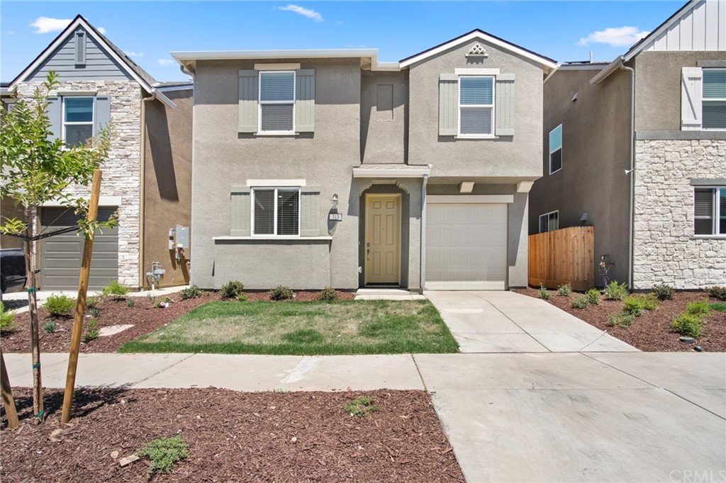313 Sullivan Drive Merced, CA 95348 - Photo 1 of 1 a front view of a house with a yard and garage