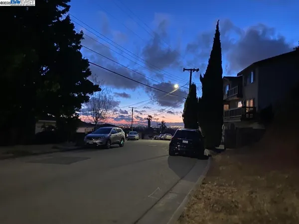 a view of a city street with cars