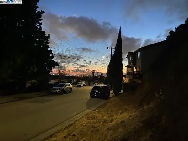 a view of a city street with cars