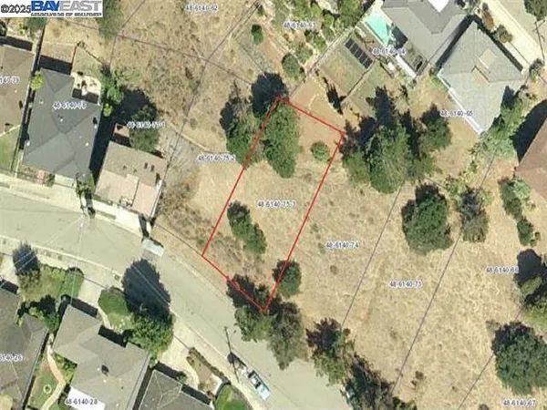 an aerial view of residential house with parking