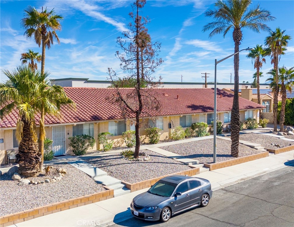 27700 Avenida Terrazo Cathedral City, CA 92234 - Photo 1 of 25 a car parked in front of a building