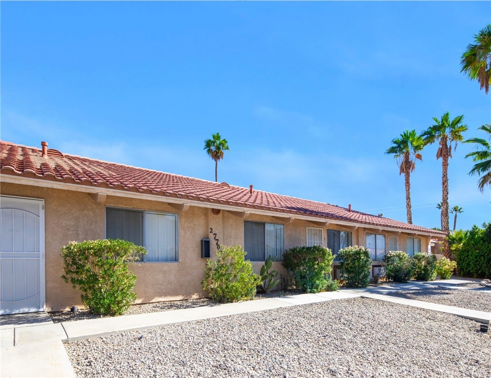 27700 Avenida Terrazo Cathedral City, CA 92234 - Photo 13 of 25 a front view of a house with a yard