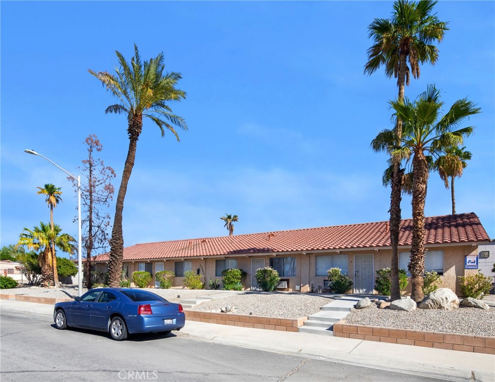 27700 Avenida Terrazo Cathedral City, CA 92234 - Photo 16 of 25 a car parked in front of a building with palm trees