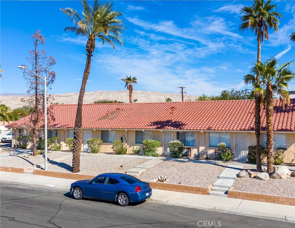 27700 Avenida Terrazo Cathedral City, CA 92234 - Photo 21 of 25 a front view of a house with garden and patio