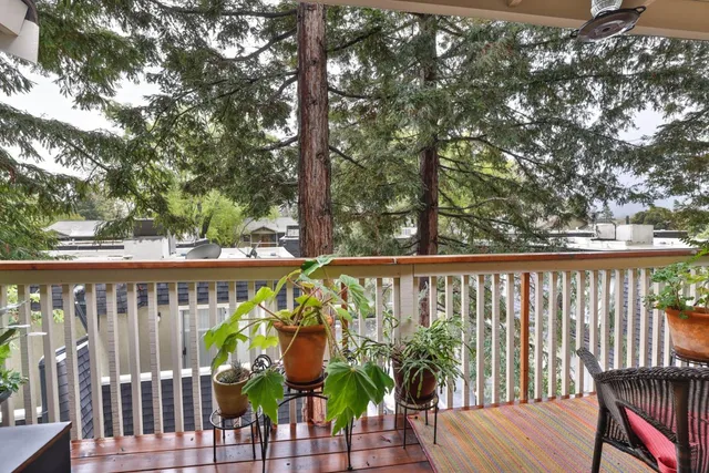 a view of a balcony with wooden floor