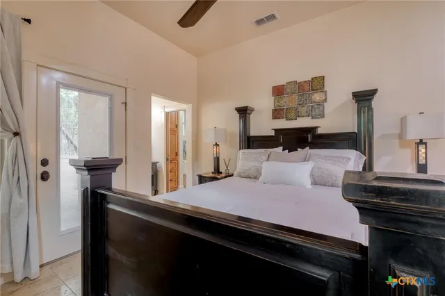 a bedroom with a bed and a dresser