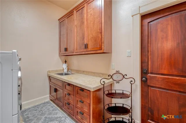 a living room with furniture a fireplace and a floor to ceiling window