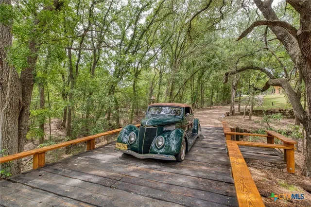 a view of backyard with small cabin