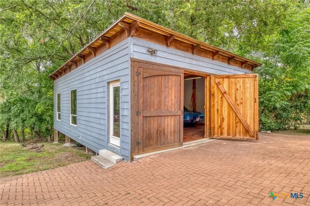 a view of a room with cars parked