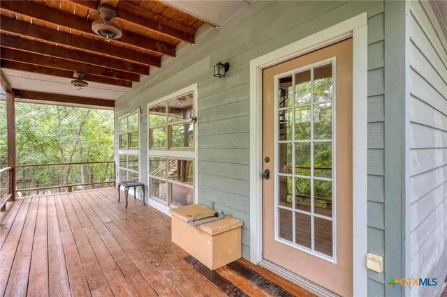 a kitchen that has a lot of cabinets in it and wooden floors