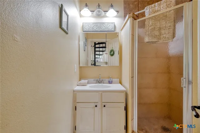 a living room with a bed furniture and a window