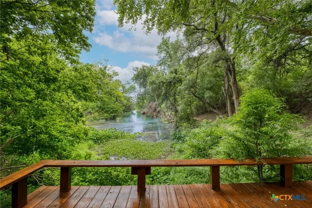 a view of a chairs and table on the wooden floor