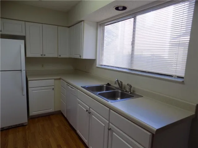 a kitchen with a sink and cabinets