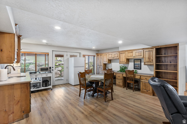 882 Sego Lily Way Mapleton, UT 84664 - Photo 20 of 41 Spacious interior featuring wood-finish flooring, recessed lighting, and extensive built-in cabinetry
