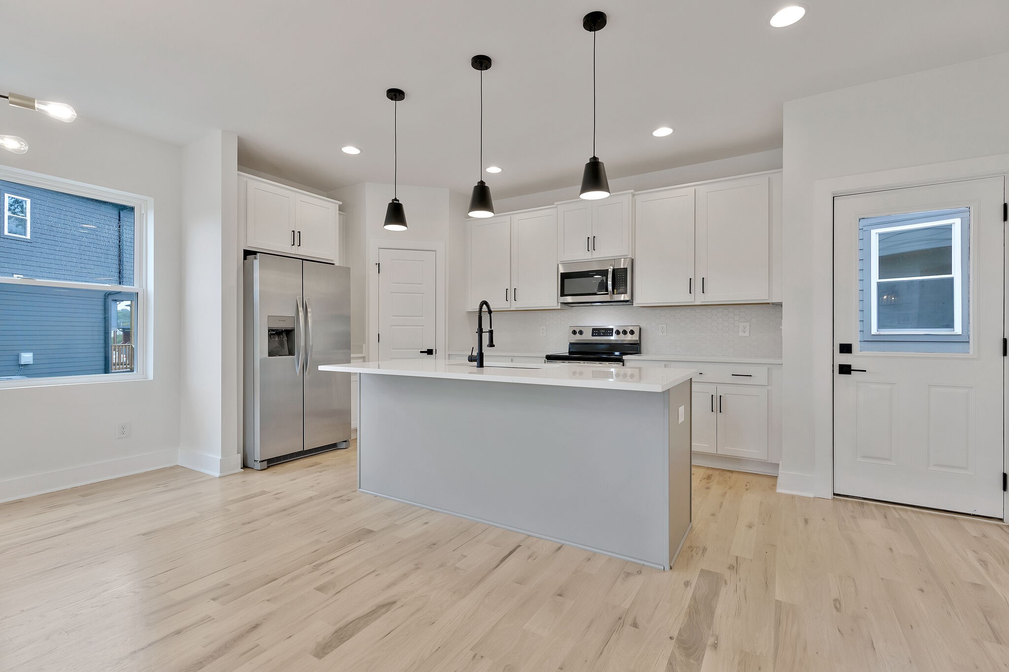 193 Paragon Mills Road Nashville, TN 37211 - Photo 12 of 31 a kitchen with stainless steel appliances granite countertop a refrigerator a sink and white cabinets