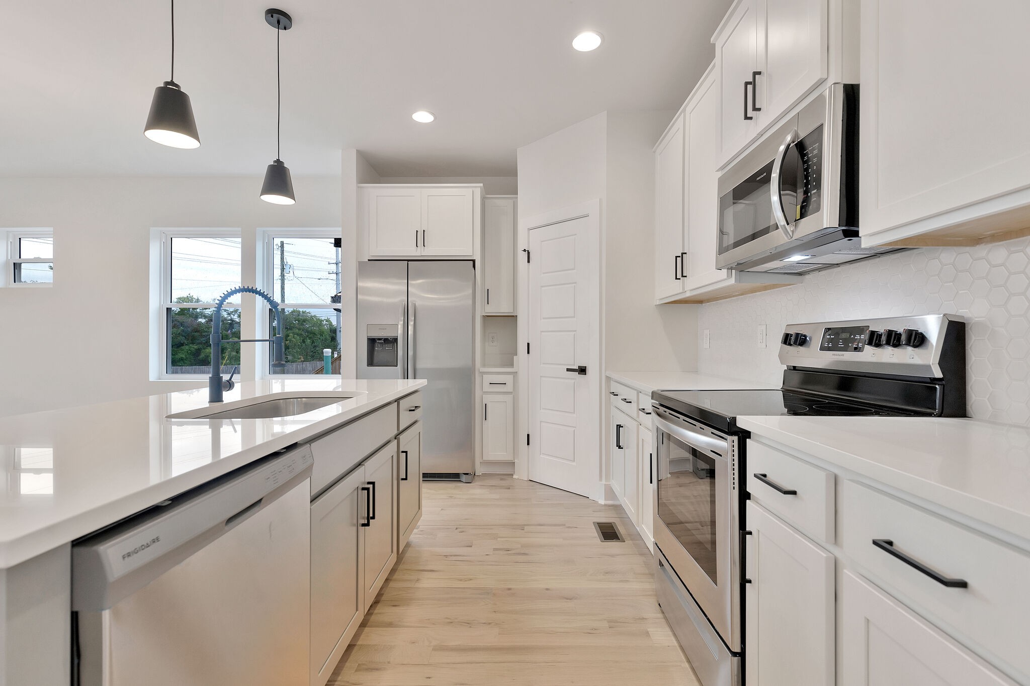 193 Paragon Mills Road Nashville, TN 37211 - Photo 14 of 31 a kitchen with stainless steel appliances kitchen island granite countertop a sink and a stove top oven