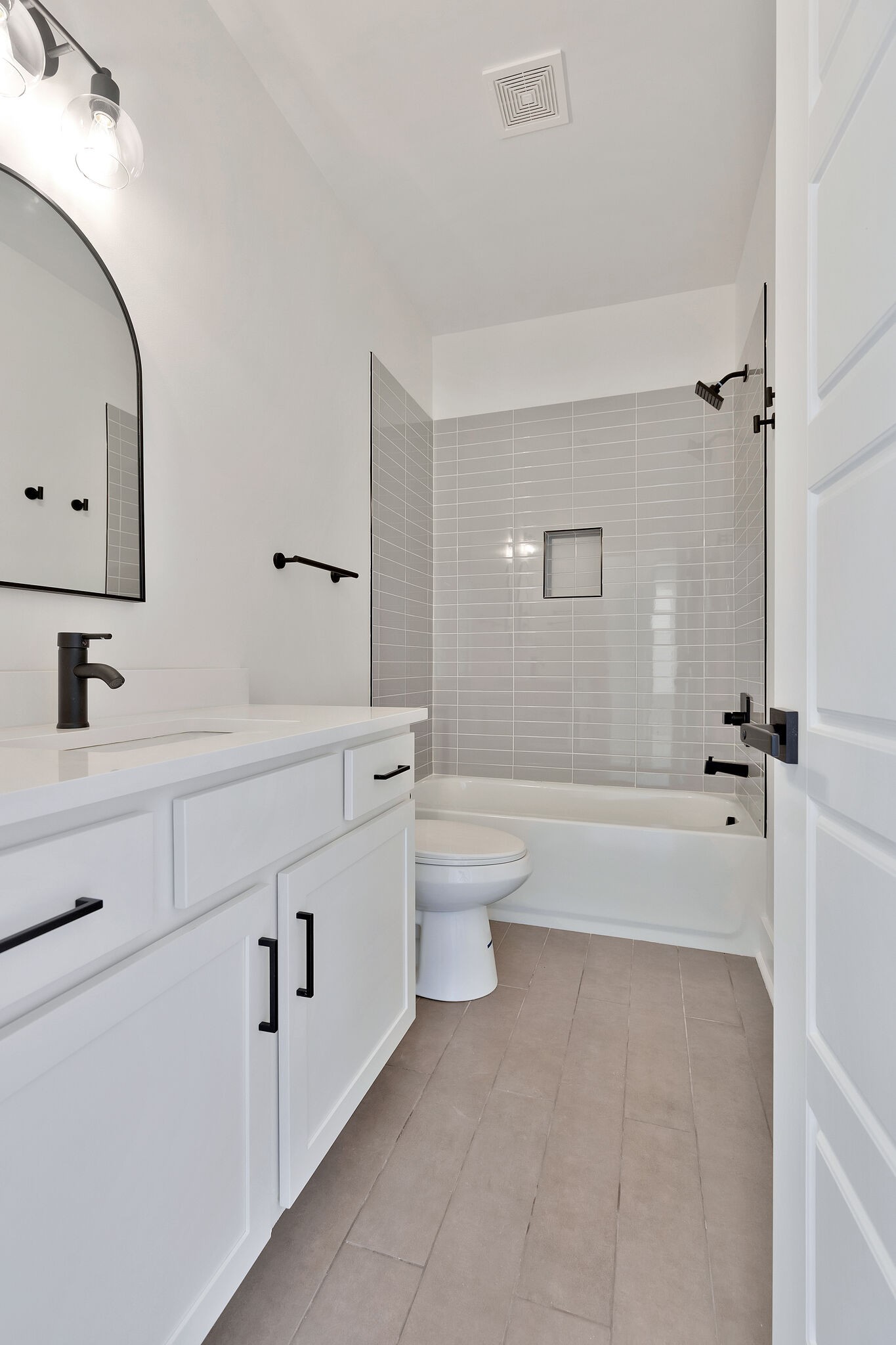 193 Paragon Mills Road Nashville, TN 37211 - Photo 18 of 31 a bathroom with a double vanity sink toilet mirror and bathtub