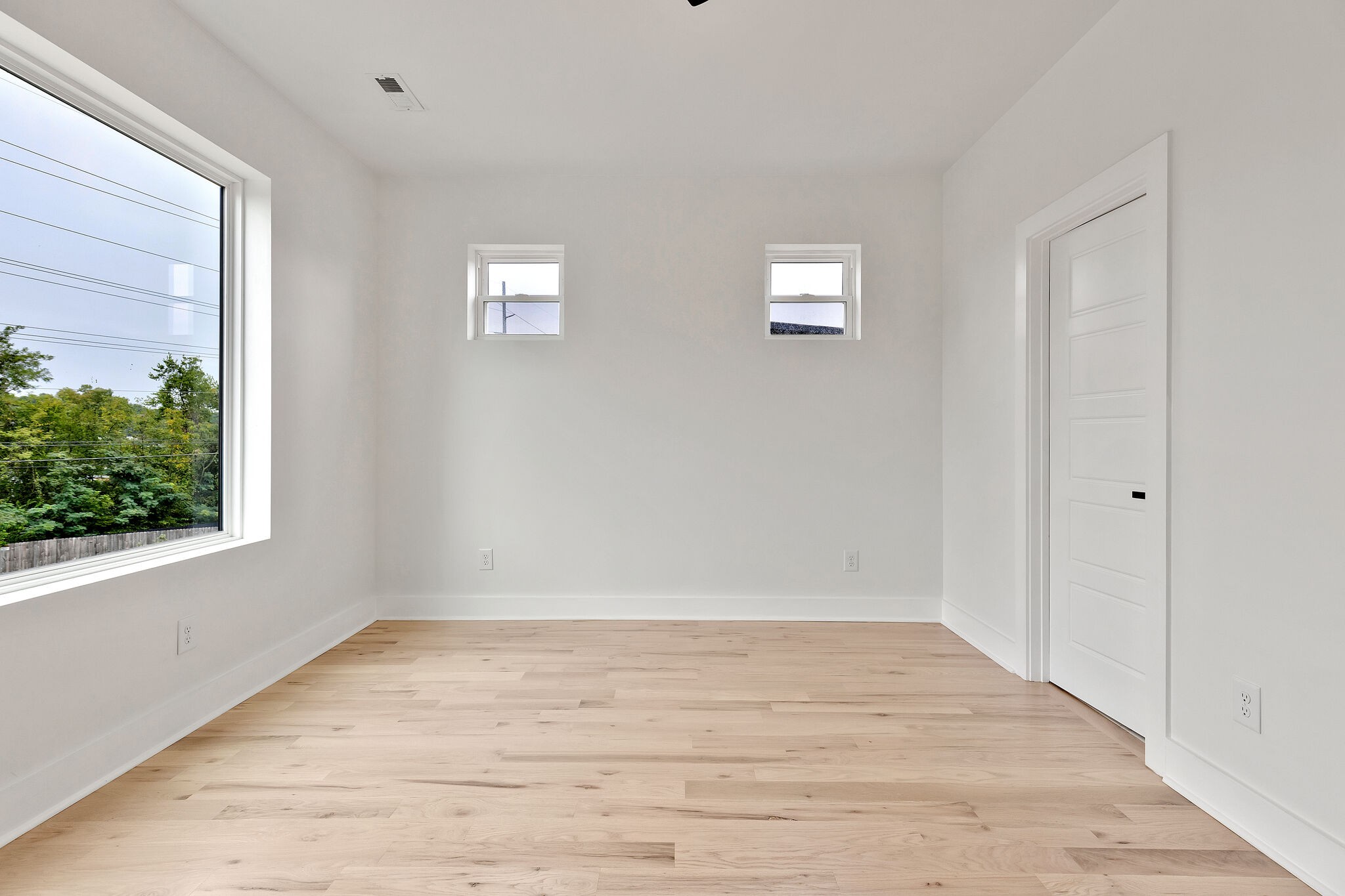193 Paragon Mills Road Nashville, TN 37211 - Photo 24 of 31 a view of an empty room with wooden floor and a window