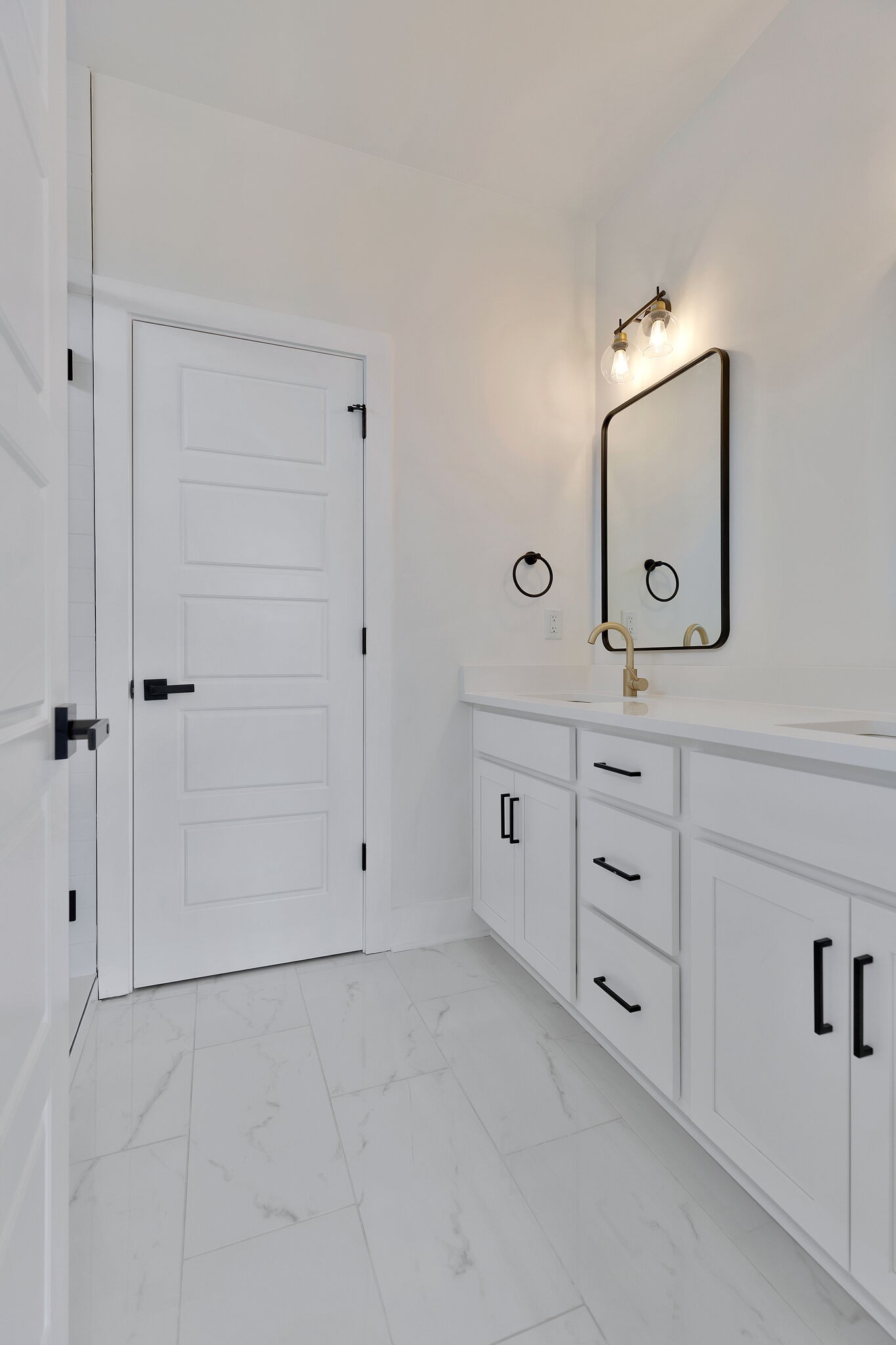 193 Paragon Mills Road Nashville, TN 37211 - Photo 26 of 31 a bathroom with a double vanity sink and mirror