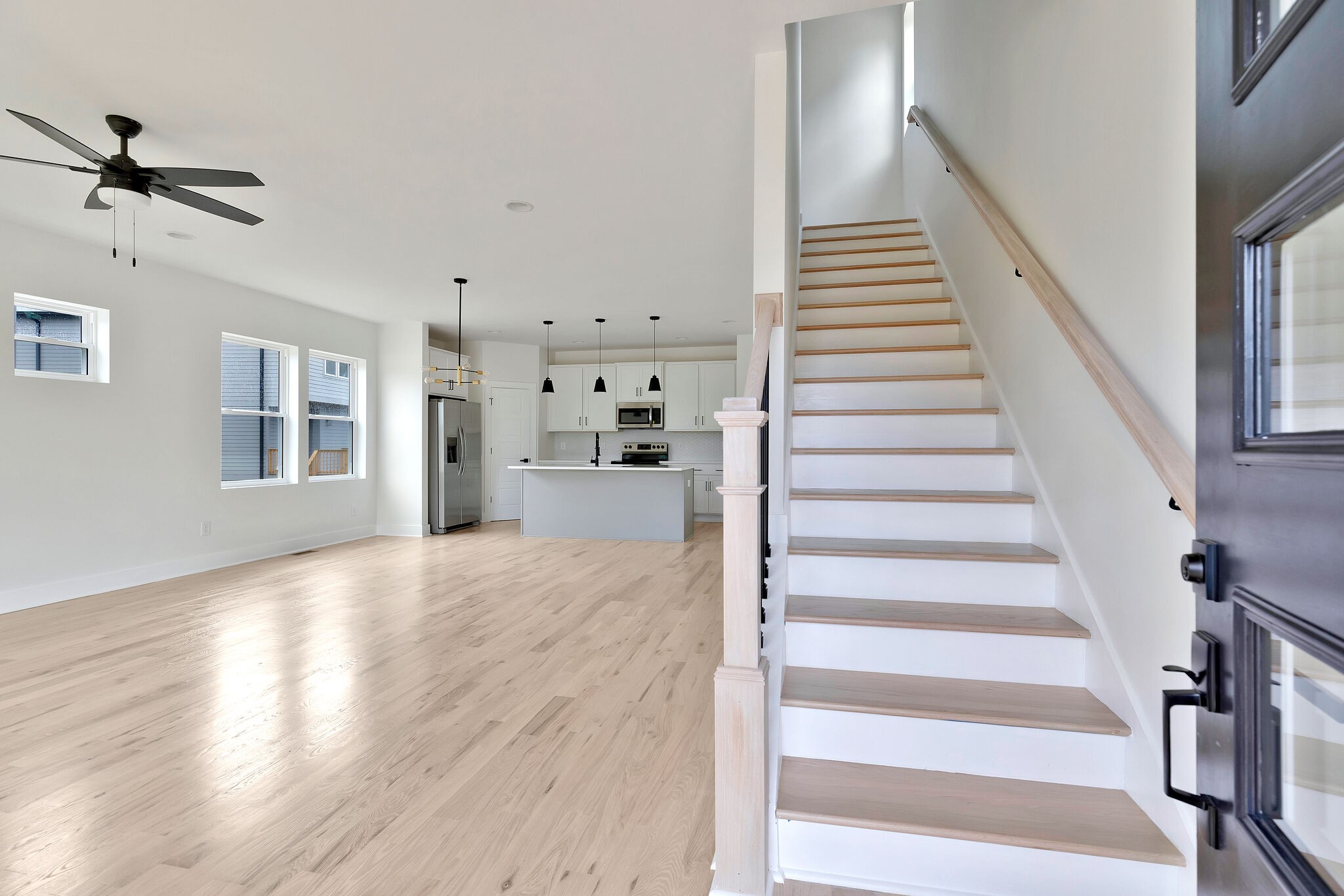 193 Paragon Mills Road Nashville, TN 37211 - Photo 6 of 31 a view of a livingroom with wooden floor stairs and a living room