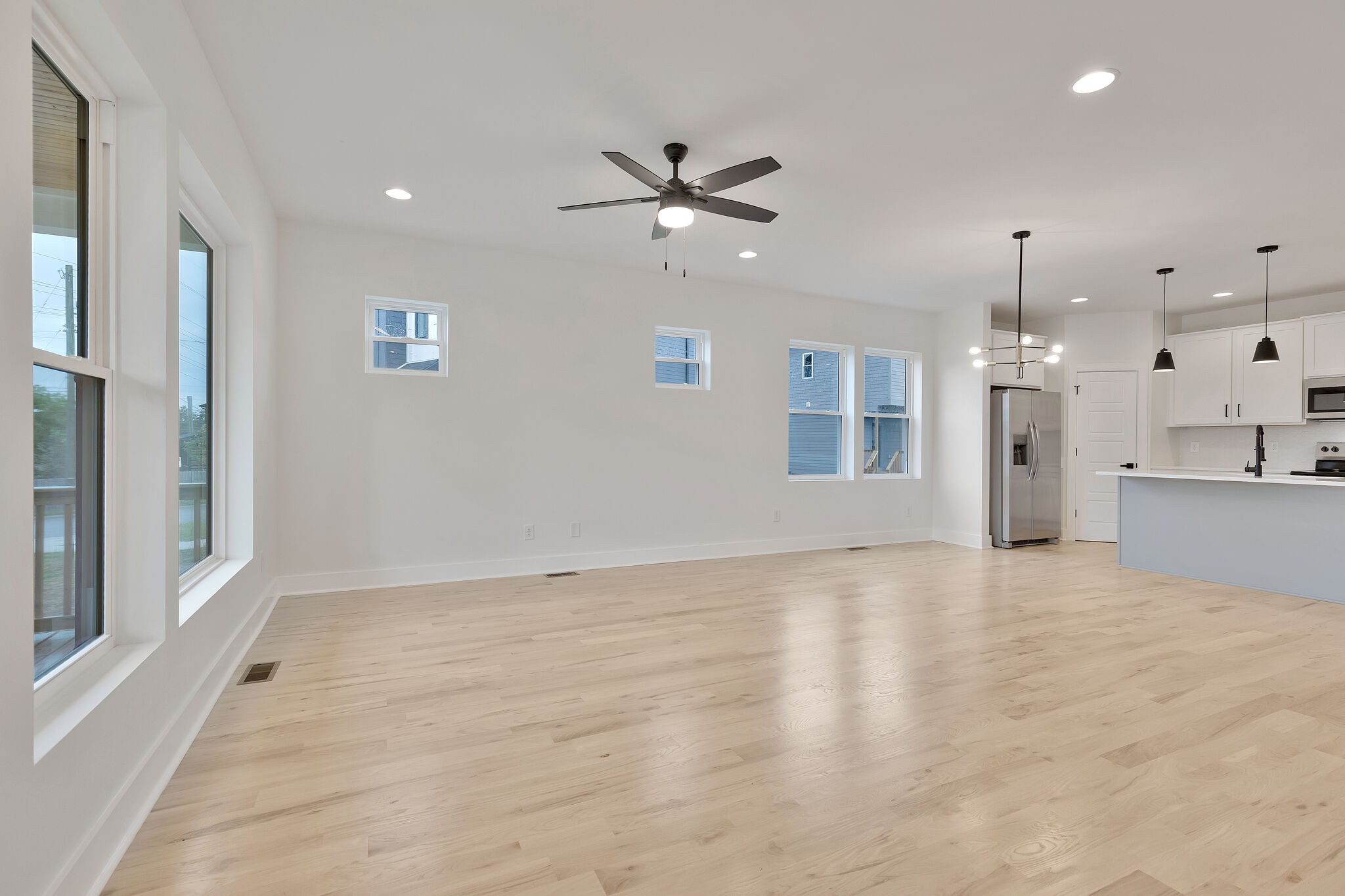 193 Paragon Mills Road Nashville, TN 37211 - Photo 8 of 31 a view of a livingroom with a ceiling fan window and a kitchen