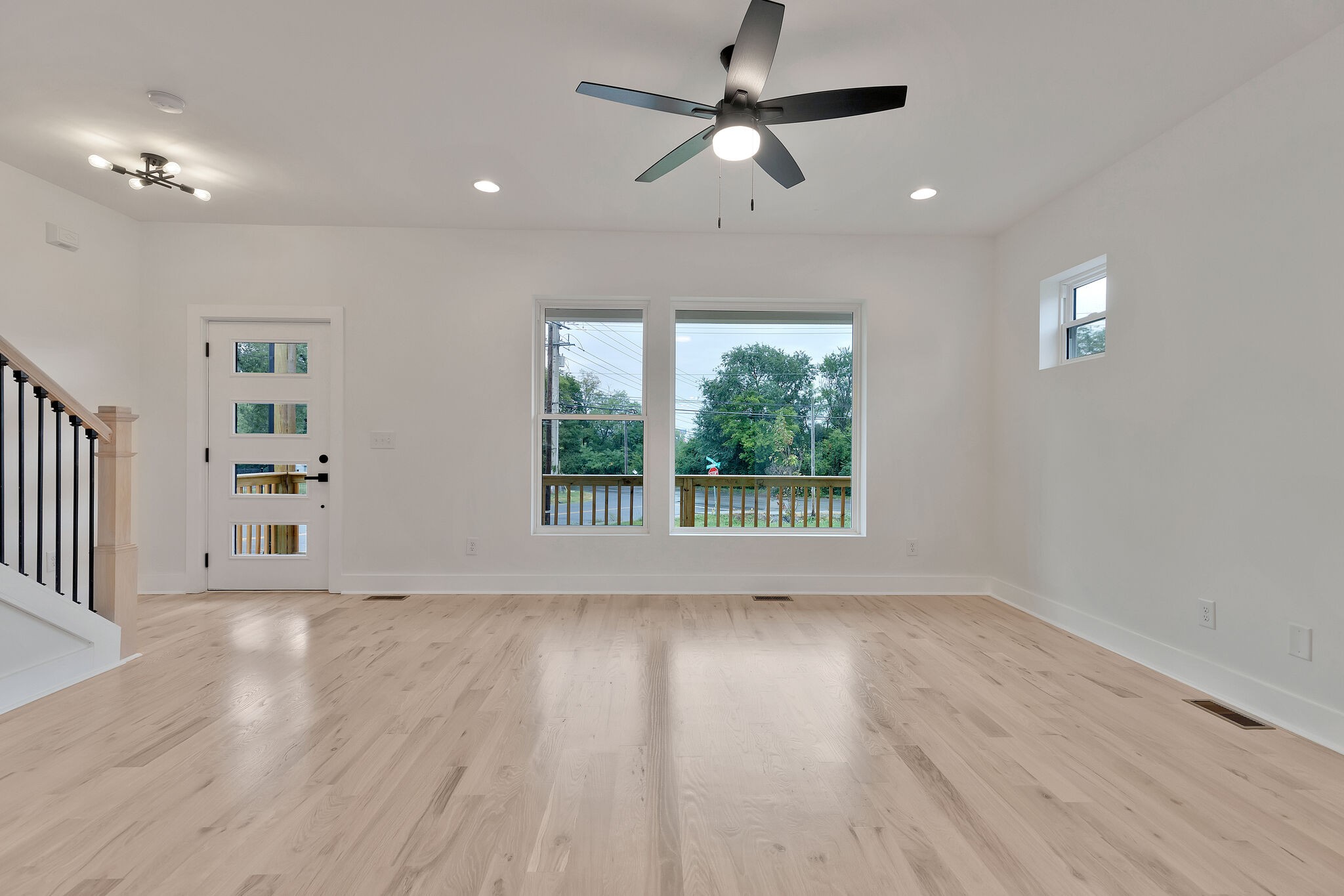 193 Paragon Mills Road Nashville, TN 37211 - Photo 9 of 31 a view of an empty room with wooden floor and a window