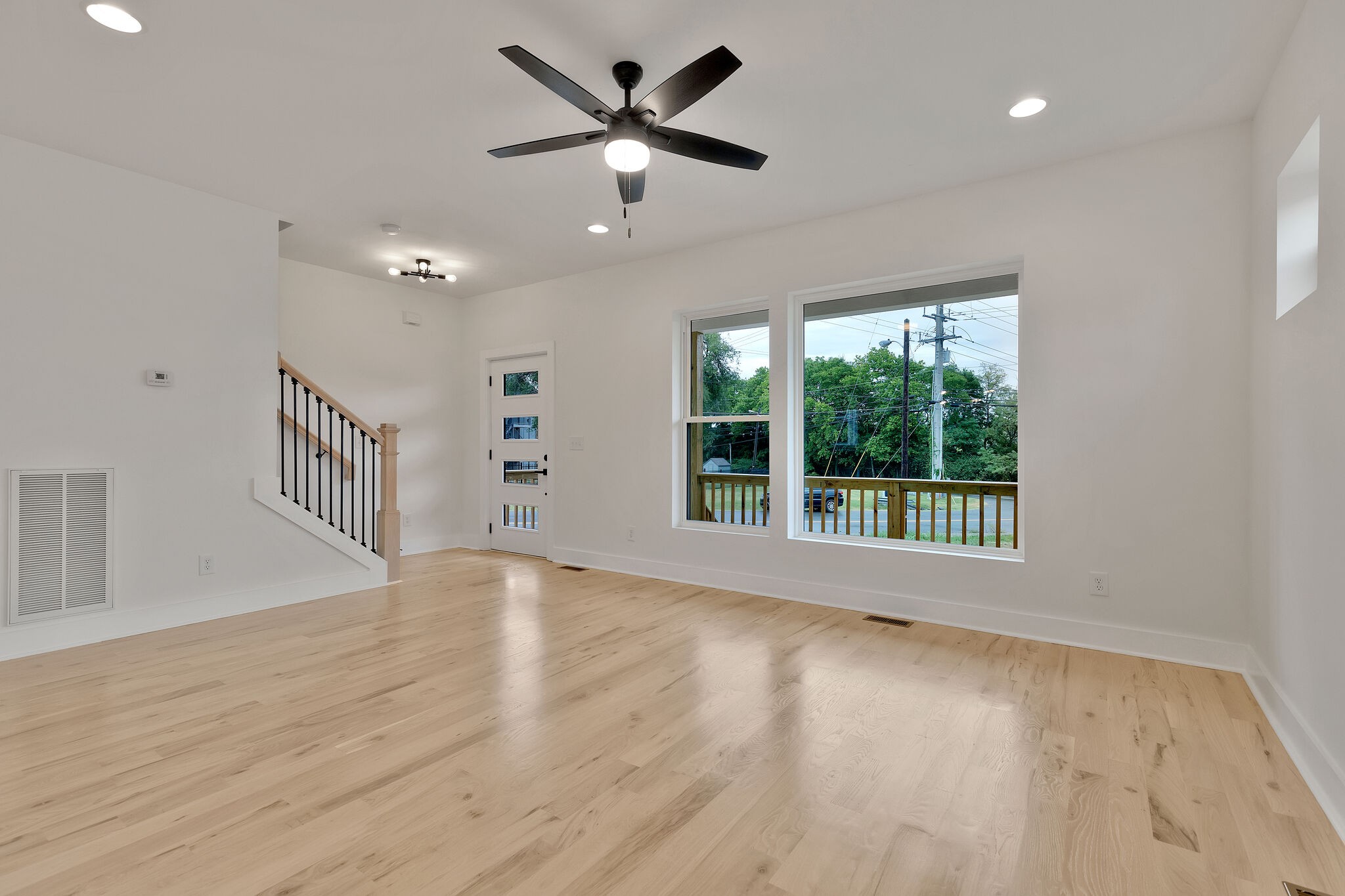 193 Paragon Mills Road Nashville, TN 37211 - Photo 10 of 31 a view of an empty room with a window and wooden floor