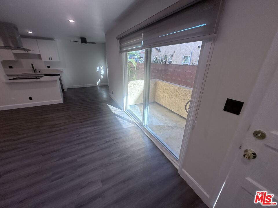 2228 20th Street, Unit 2 Santa Monica, CA 90405 - Photo 22 of 43 a kitchen with cabinets and wooden floor