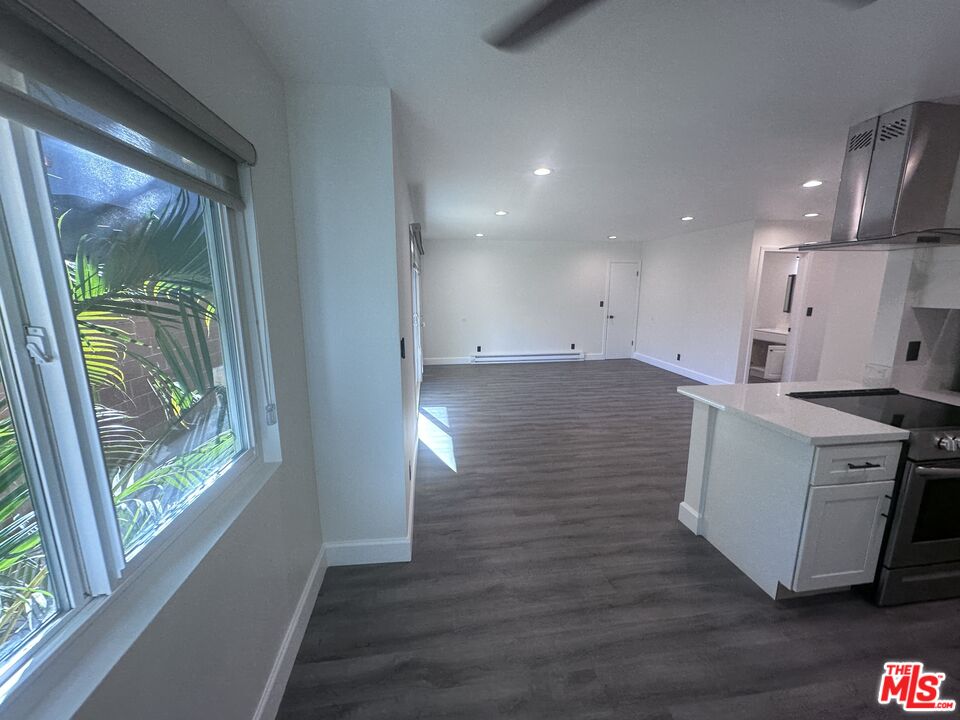 2228 20th Street, Unit 2 Santa Monica, CA 90405 - Photo 23 of 43 a view of a kitchen with furniture and wooden floor