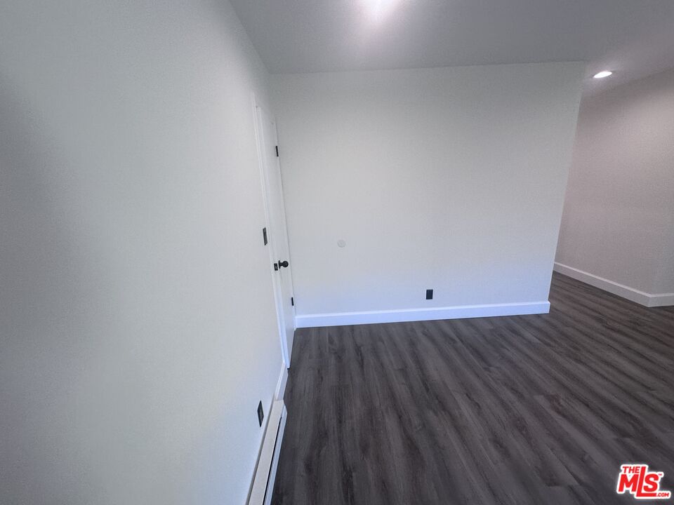2228 20th Street, Unit 2 Santa Monica, CA 90405 - Photo 27 of 43 a view of a room with wooden floor and a sink