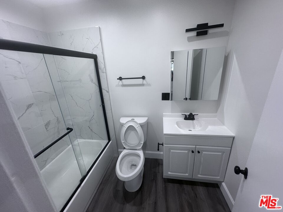 2228 20th Street, Unit 2 Santa Monica, CA 90405 - Photo 29 of 43 a bathroom with a toilet sink and mirror