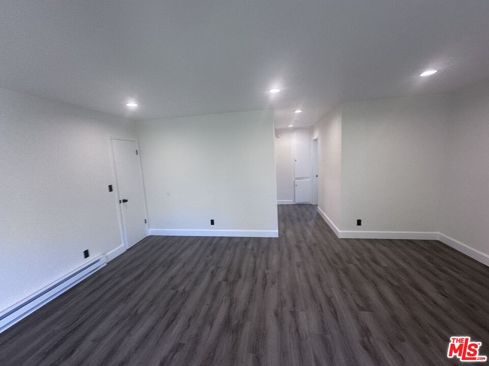2228 20th Street, Unit 2 Santa Monica, CA 90405 - Photo 3 of 43 a view of an empty room with wooden floor