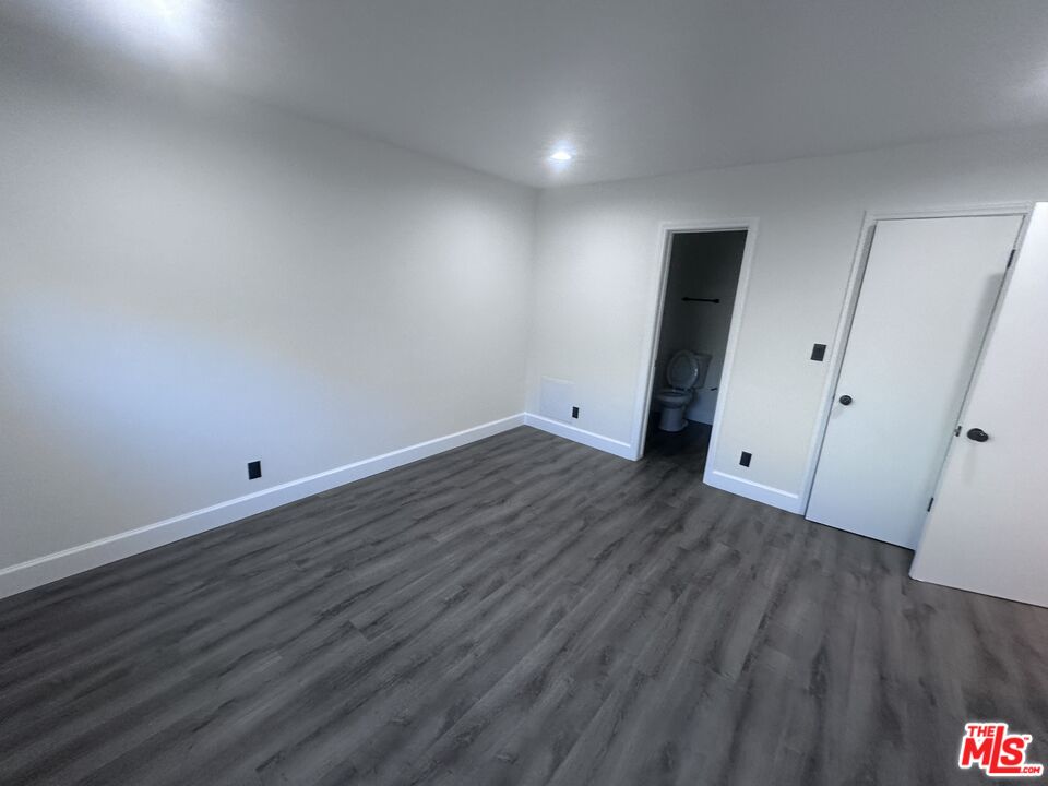 2228 20th Street, Unit 2 Santa Monica, CA 90405 - Photo 35 of 43 a view of an empty room with wooden floor
