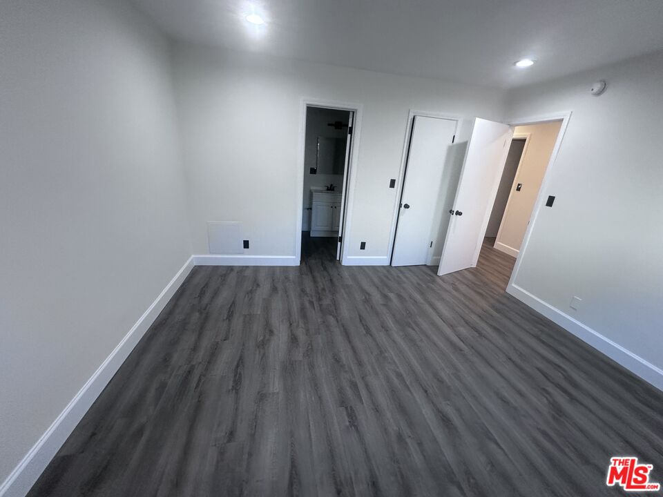 2228 20th Street, Unit 2 Santa Monica, CA 90405 - Photo 36 of 43 a view of a room with wooden floor and a hallway