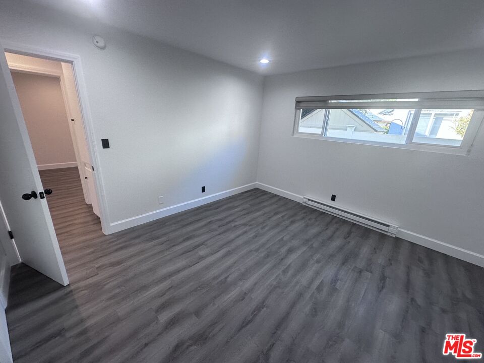 2228 20th Street, Unit 2 Santa Monica, CA 90405 - Photo 39 of 43 wooden floor in an empty room with a window