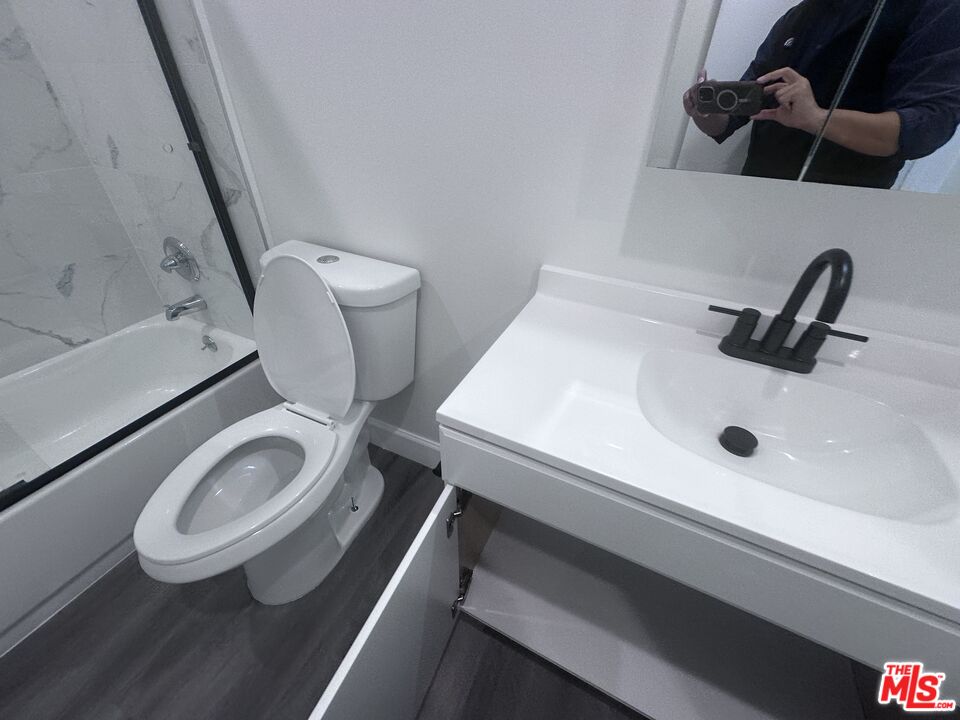 2228 20th Street, Unit 2 Santa Monica, CA 90405 - Photo 41 of 43 a bathroom with a toilet and a sink