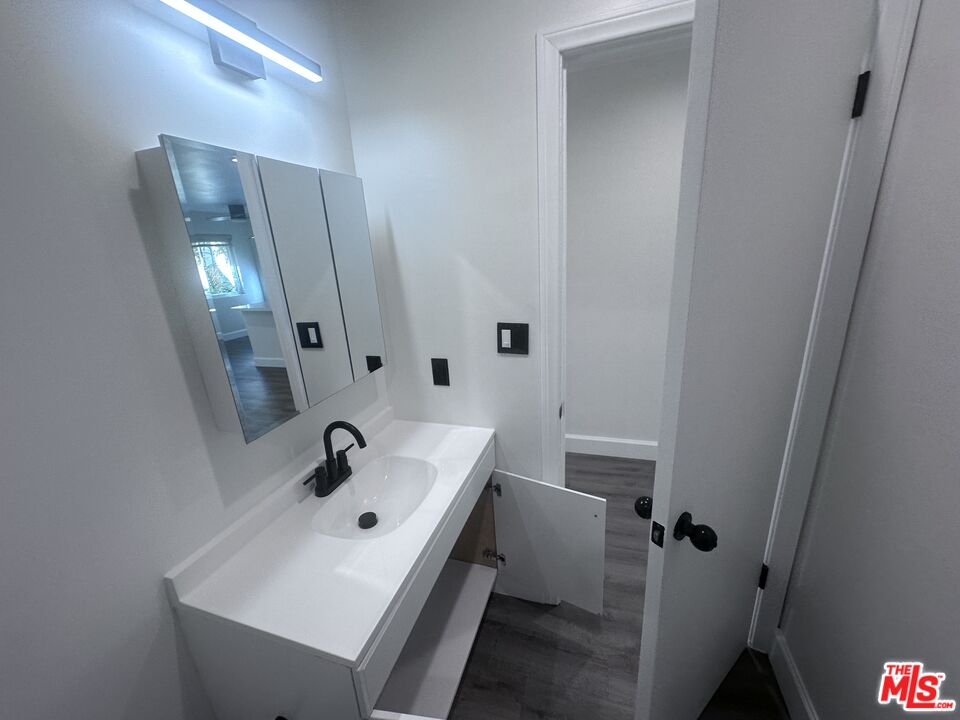 2228 20th Street, Unit 2 Santa Monica, CA 90405 - Photo 43 of 43 a bathroom with a sink a toilet and shower