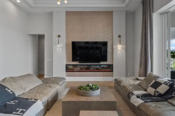 a kitchen with stainless steel appliances granite countertop a sink a stove and a wooden floors