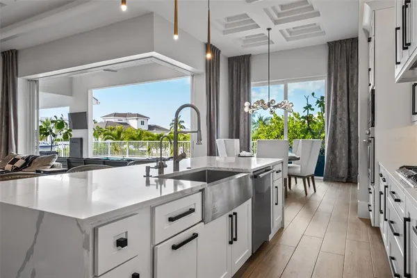 a kitchen with metallic refrigerator freezer and a dishwasher