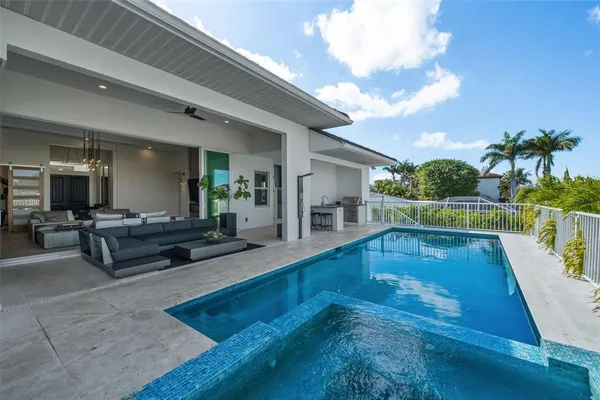 a view of walk in closet with clothes