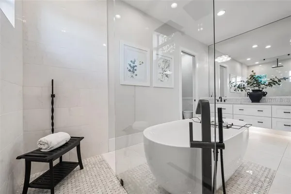 an aerial view of house with yard swimming pool and ocean view