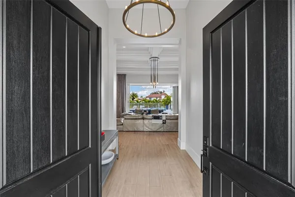 a living room with couches and a flat screen tv