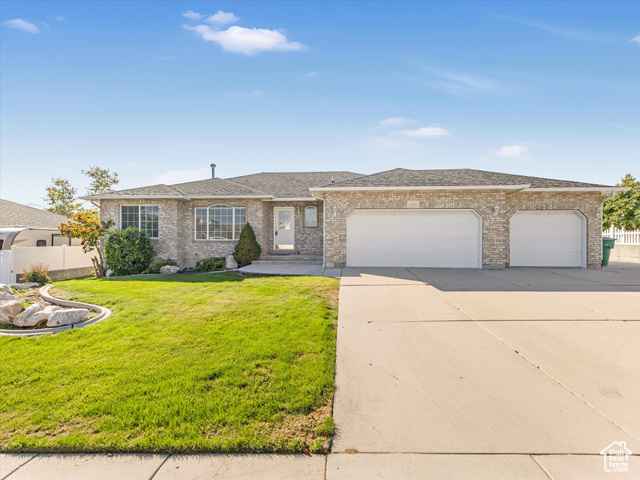 1165 West Johnson Ridge Lane West Jordan, UT 84084 - Photo 1 of 1 Single story home with a front yard and a garage