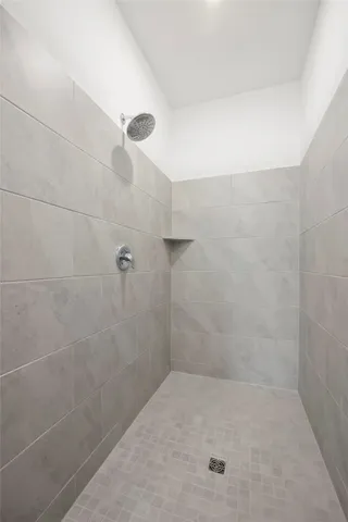 a white kitchen with a sink and cabinets
