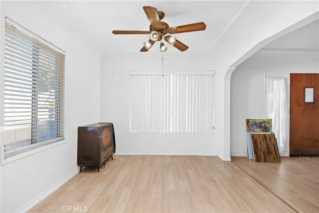 a view of workspace with wooden floor and windows