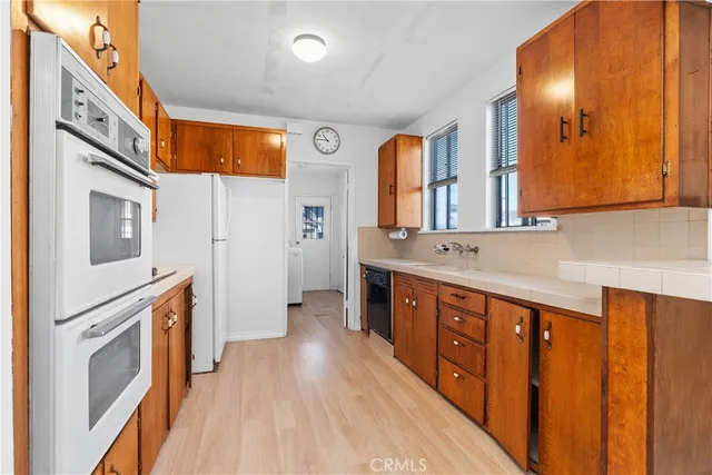 a spacious bathroom with a double vanity sink and a mirror