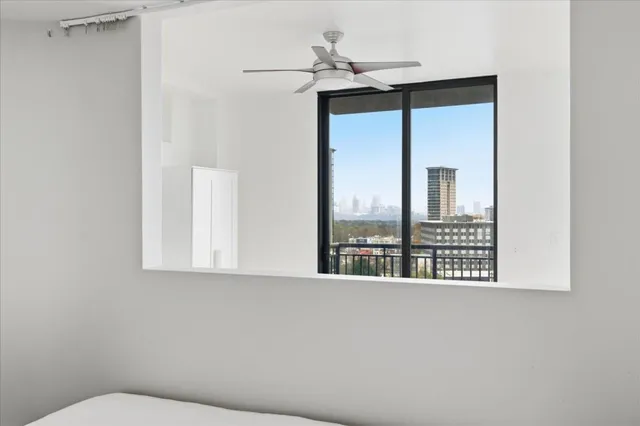 a bathroom with a window a sink and a mirror